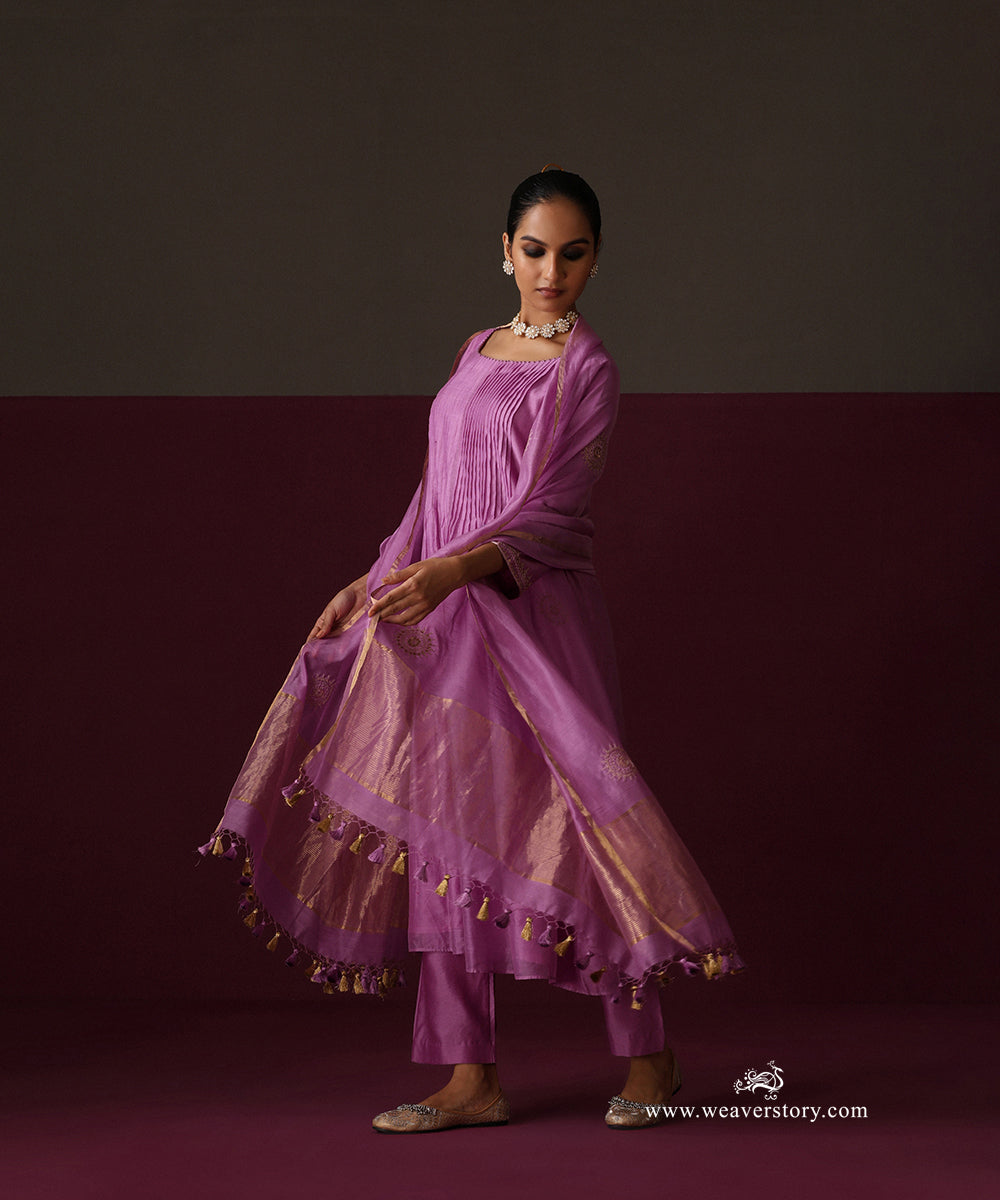 Model wearing Afsana, an orchid purple pleated Chanderi suit with round boota dupatta and matching pants