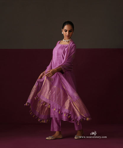 Model wearing Afsana, an orchid purple pleated Chanderi suit with round boota dupatta and matching pants