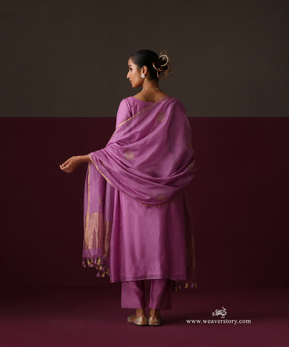 Back view of the orchid purple suit and dupatta with spaced round bootas and gold tissue borders