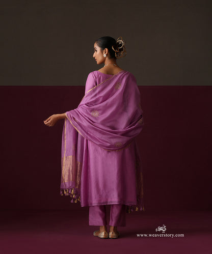 Back view of the orchid purple suit and dupatta with spaced round bootas and gold tissue borders