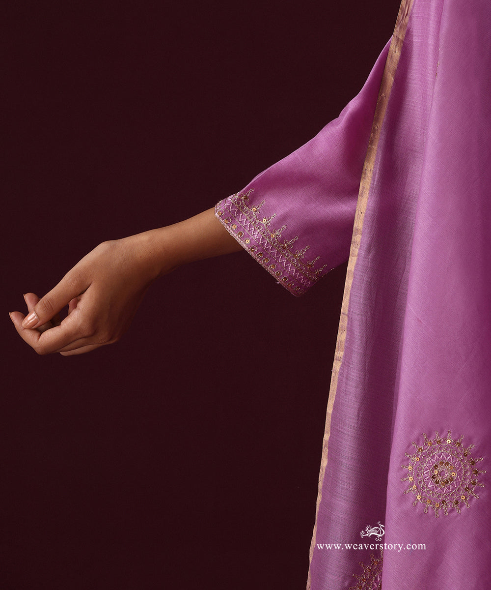 Detail of zardozi embroidery on the three-quarter sleeve cuff and a round boota on the dupatta