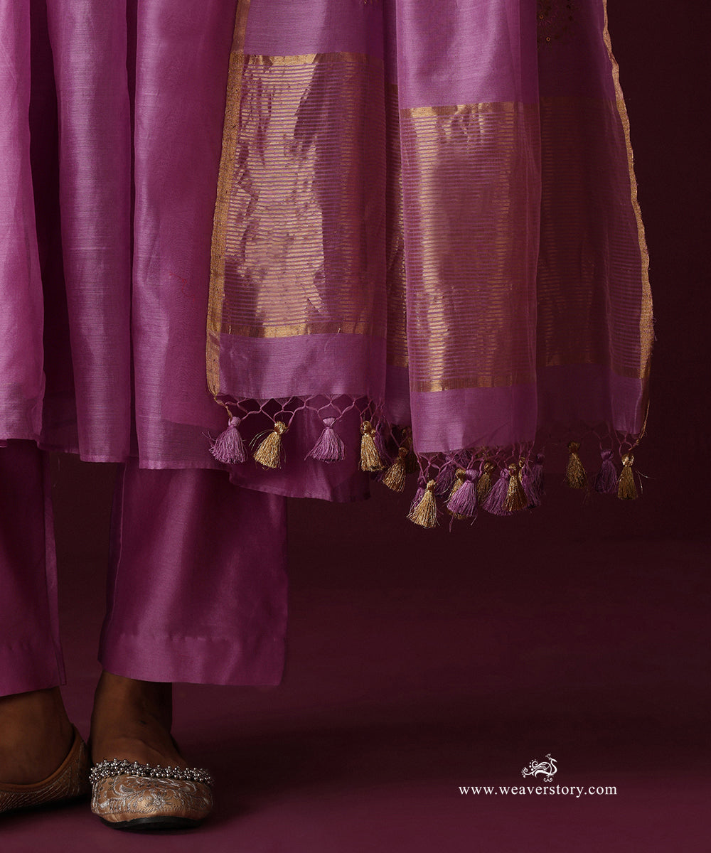 Detail of the orchid purple straight pants, striped gold dupatta border and purple and gold tassels