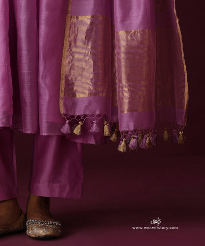 Detail of the orchid purple straight pants, striped gold dupatta border and purple and gold tassels