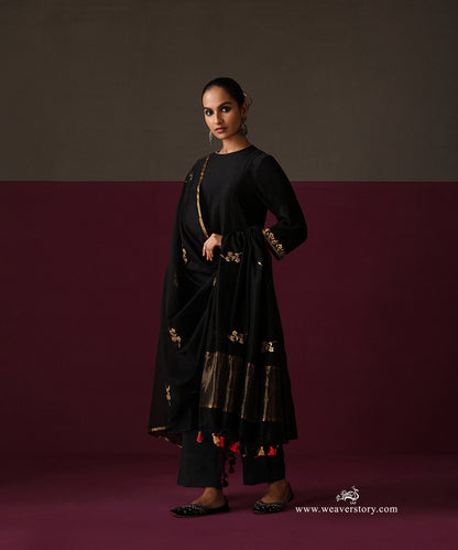 Detail of the black kurta cuff and matching dupatta with gold floral hand embroidery