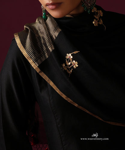 Detail of floral embroidery and the striped gold tissue border on the black Chanderi dupatta