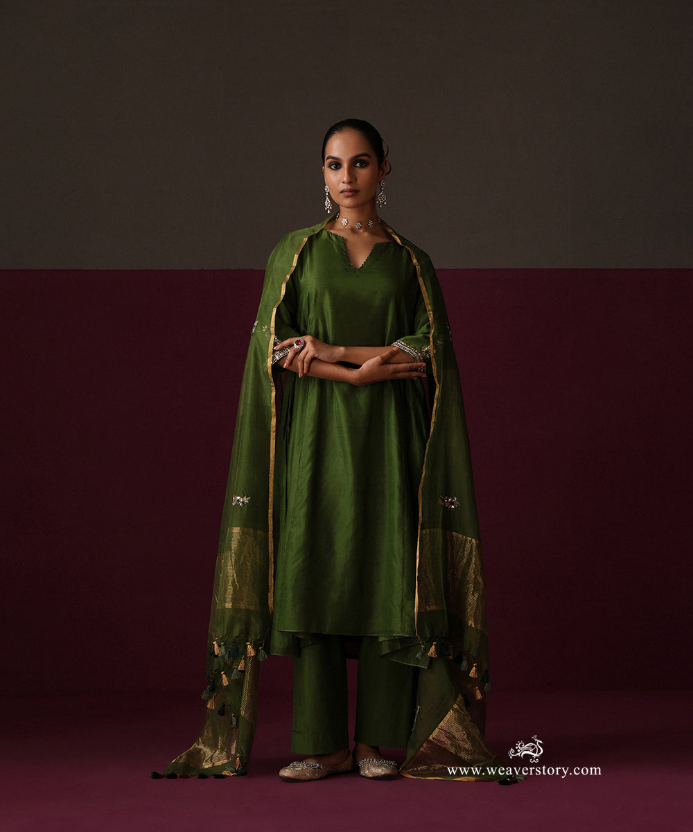 Front view of Meher in Heena green with matching pants and a gold-bordered dupatta