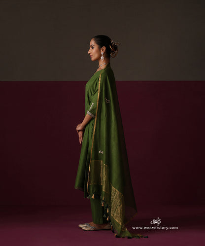 Side view of the Heena green Chanderi suit with a tasselled dupatta