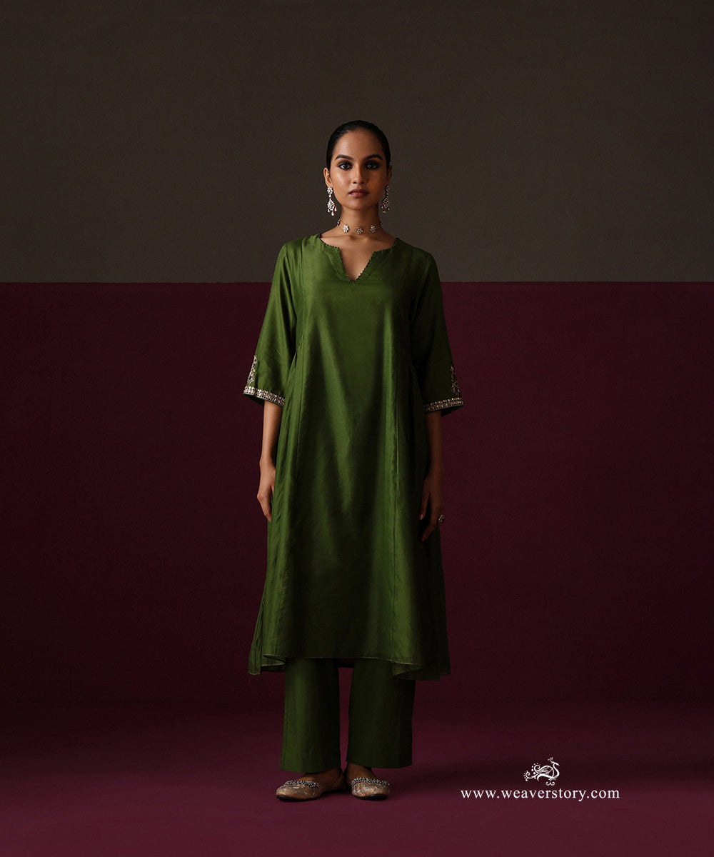 Full-length view of the Heena green A-line kurta and matching straight pants