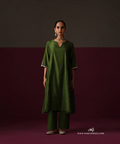 Full-length view of the Heena green A-line kurta and matching straight pants