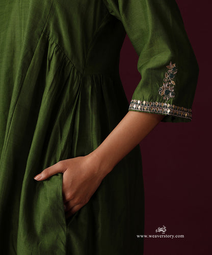 Close-up of floral embroidery and gota detailing on the Heena green kurta sleeve