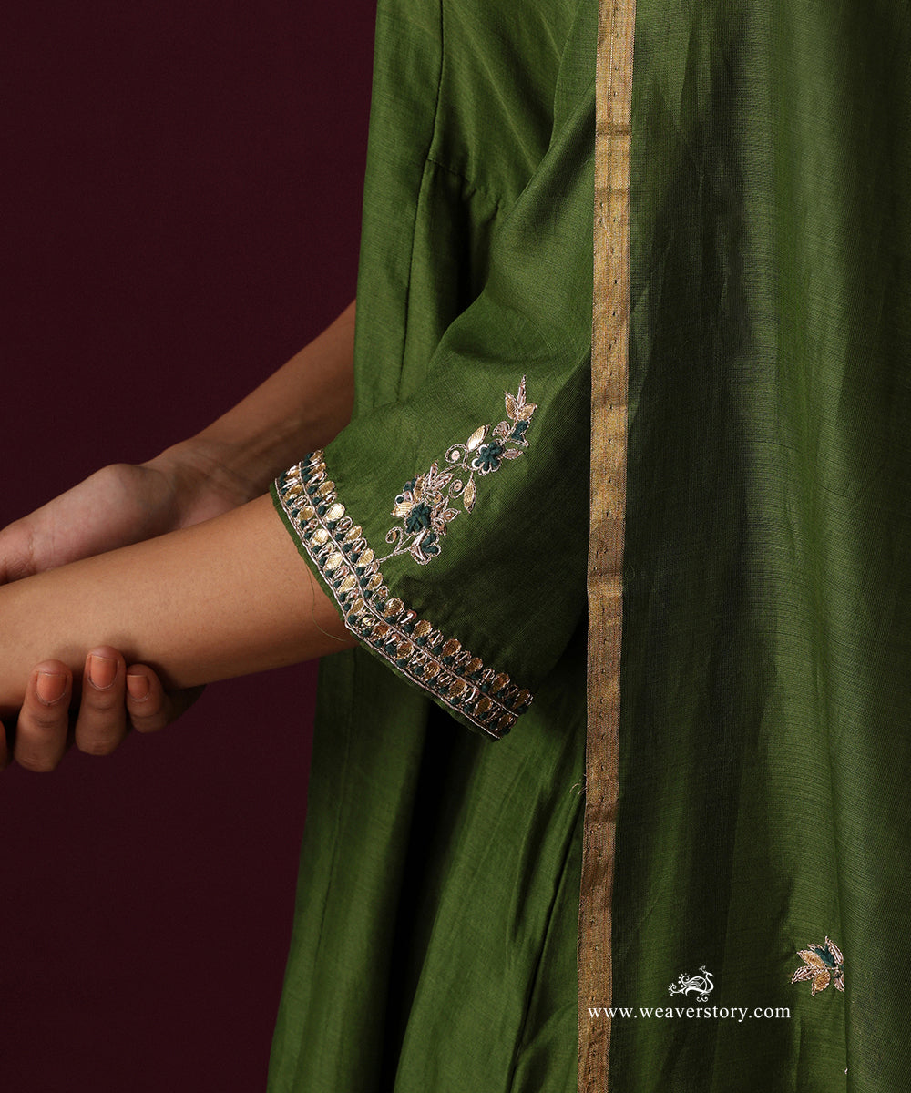 Detail of the embroidered sleeve cuff and floral motif on the Heena green dupatta