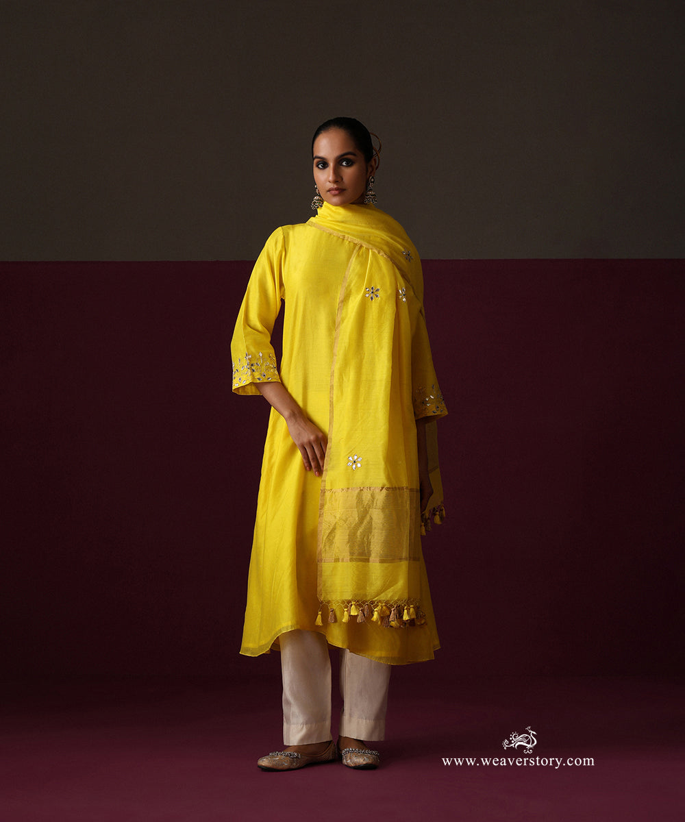 Full-length view of the yellow Chanderi kurta with its embroidered dupatta, gold border and white pants