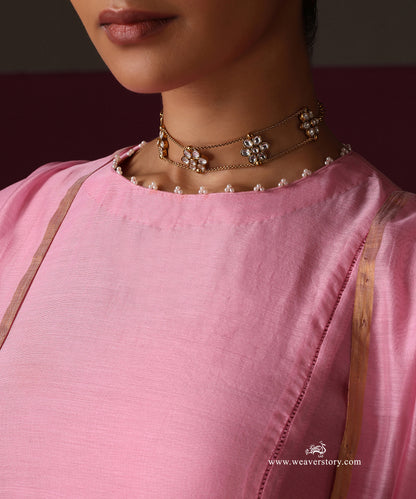 Pearl detailing along the round neckline of the pink Chanderi kurta