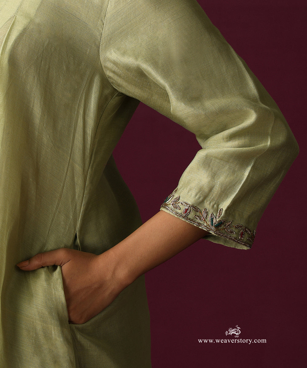Close-up of the embroidered vine along the three-quarter sleeve cuff