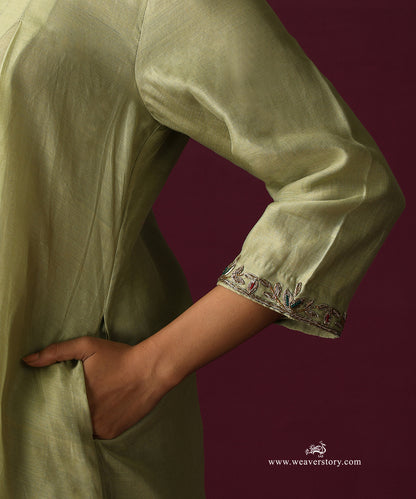Close-up of the embroidered vine along the three-quarter sleeve cuff