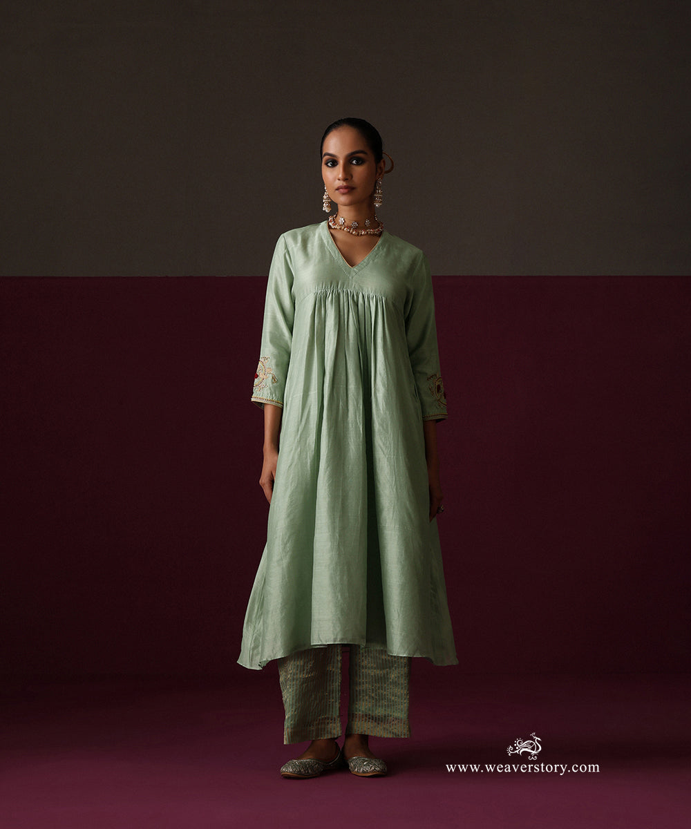 Front view of the gathered sage green kurta and striped Chanderi tissue pants