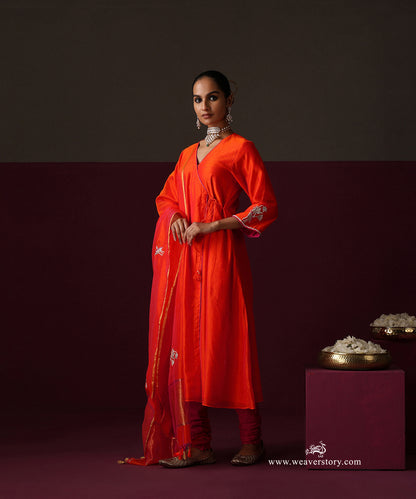 Model wearing Nilofer, an orange Chanderi Angrakha with lotus embroidered dupatta and hot pink churidar