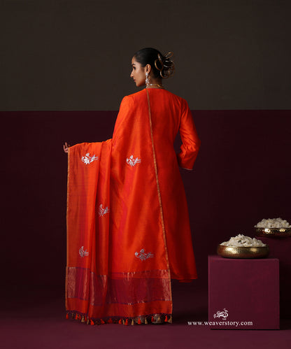 Back view of the orange Angrakha and Chanderi dupatta with spaced lotus motifs and a metallic border