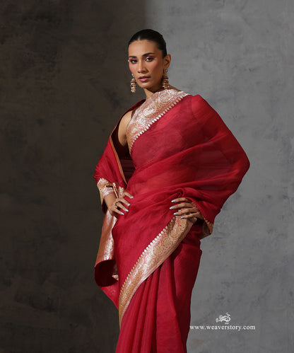 Draped view of Rukmini maroon organza saree highlighting the intricate floral zari border.