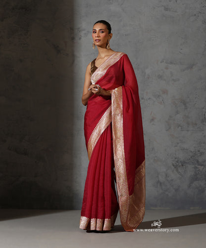 Full view of Rukmini maroon pure silk organza saree with plain body and vintage handwoven Banarasi zari border.