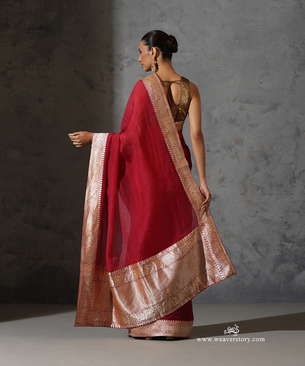 Back view of Rukmini maroon organza saree showing the vintage Banarasi zari border and broad woven pallu.