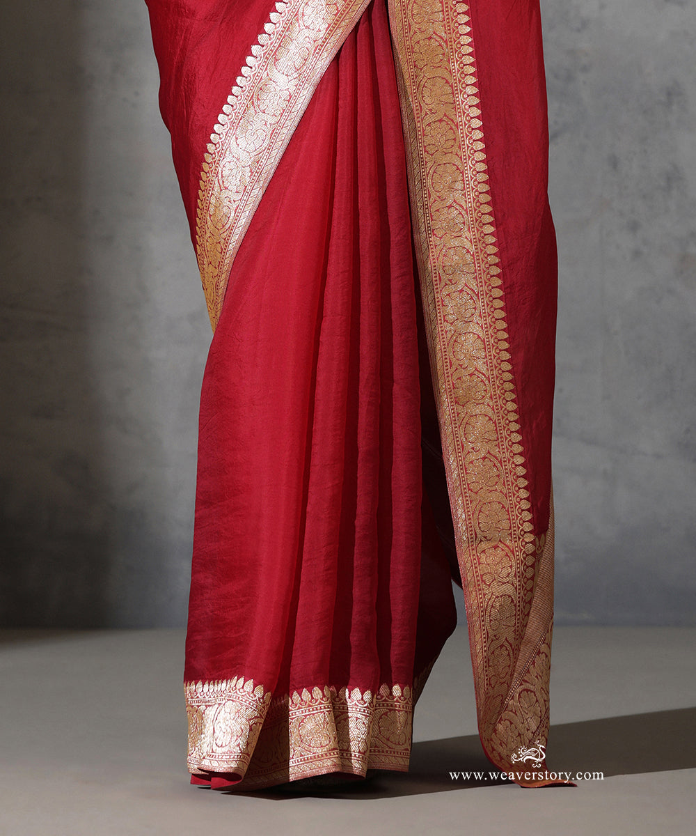 Close-up of Rukmini maroon pure silk organza saree with vintage handwoven Banarasi floral zari border.