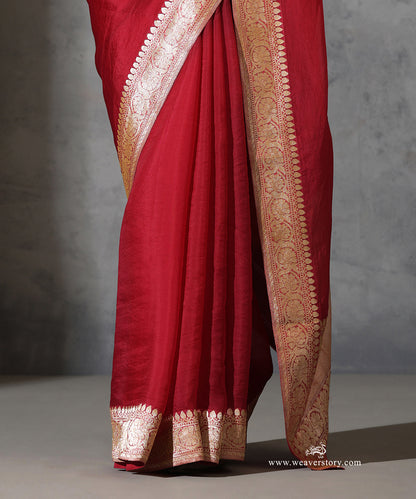 Close-up of Rukmini maroon pure silk organza saree with vintage handwoven Banarasi floral zari border.