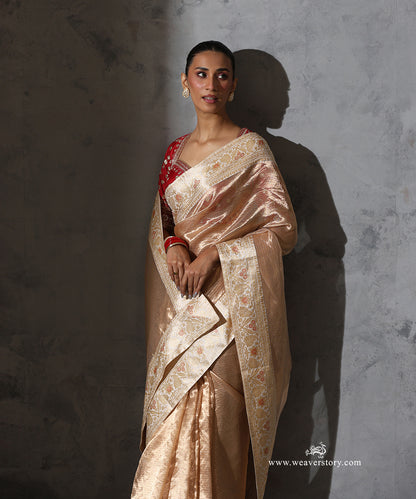 Padmika gold Tissue Organza saree with vintage Katan silk Banarasi border featuring zari, floral and paisley motifs with meenakari accents.