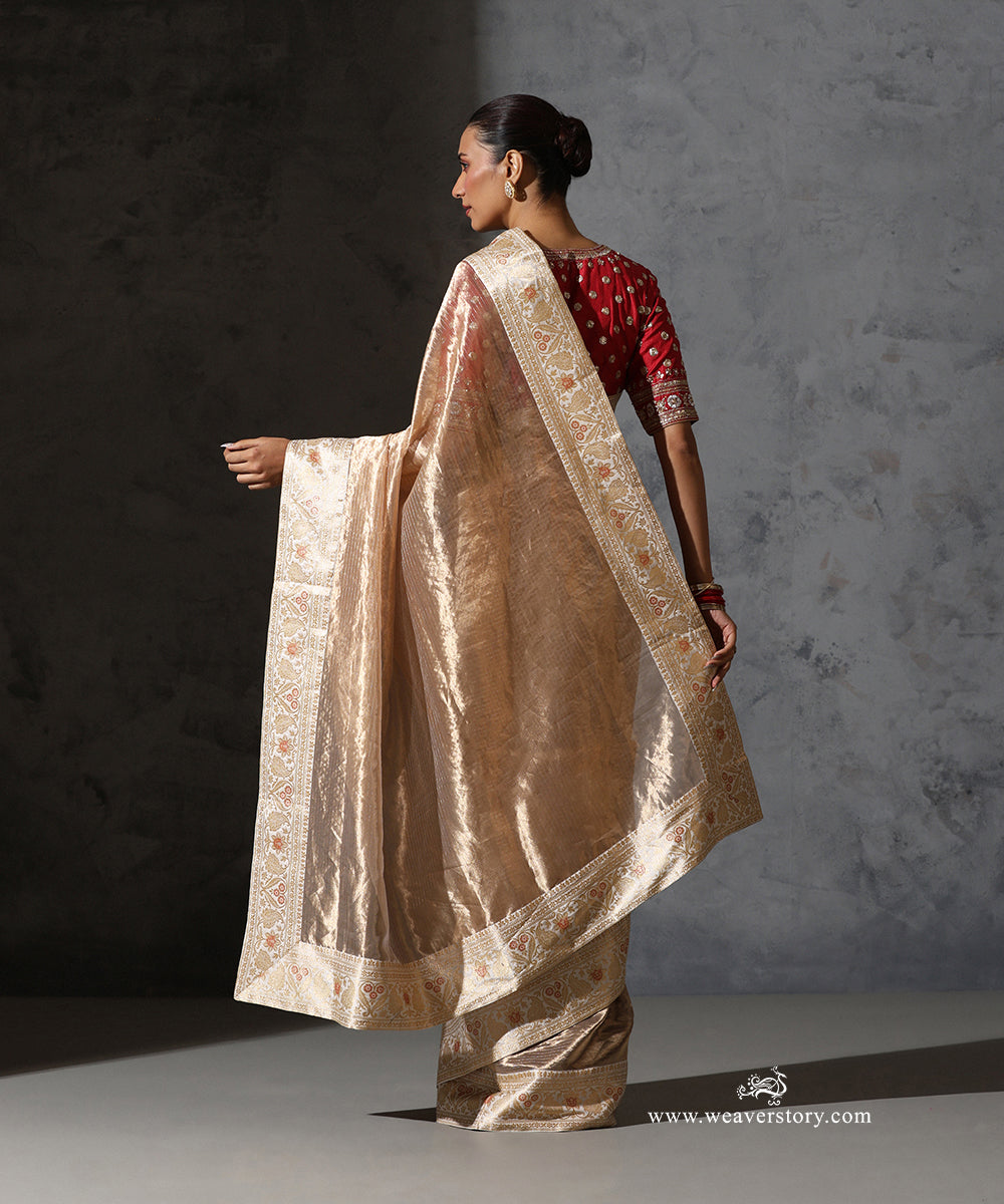 Draped view of Padmika gold Tissue Organza saree highlighting the vintage Katan silk Banarasi zari and meenakari border.