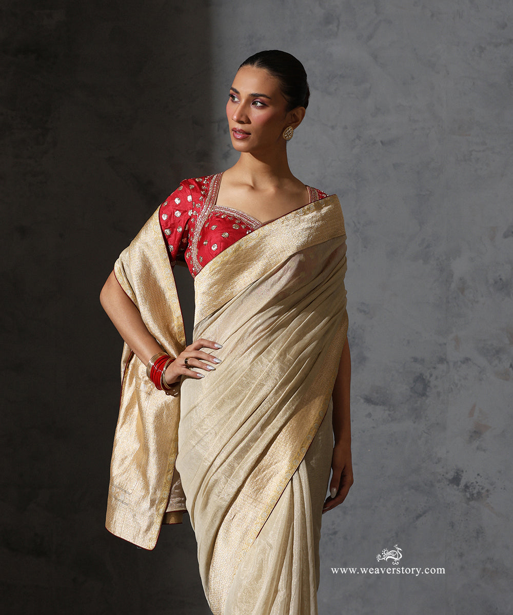 Front detail of Mridula soft pure cotton tissue saree showing its luminous drape and broad vintage Banarasi zari border.