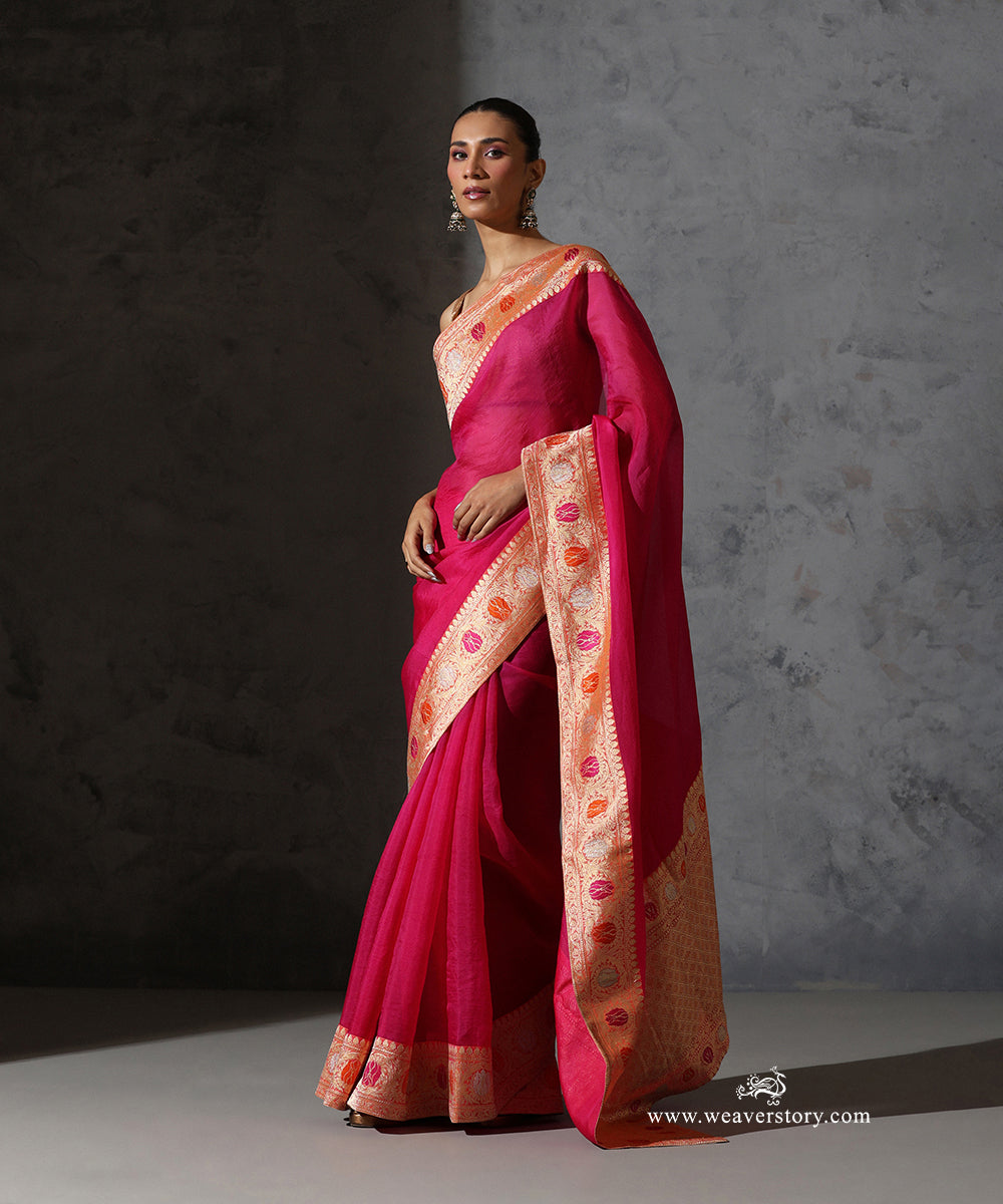Full view of Tilottama magenta pure silk organza saree with plain body and vintage handwoven meenakari Banarasi zari border.