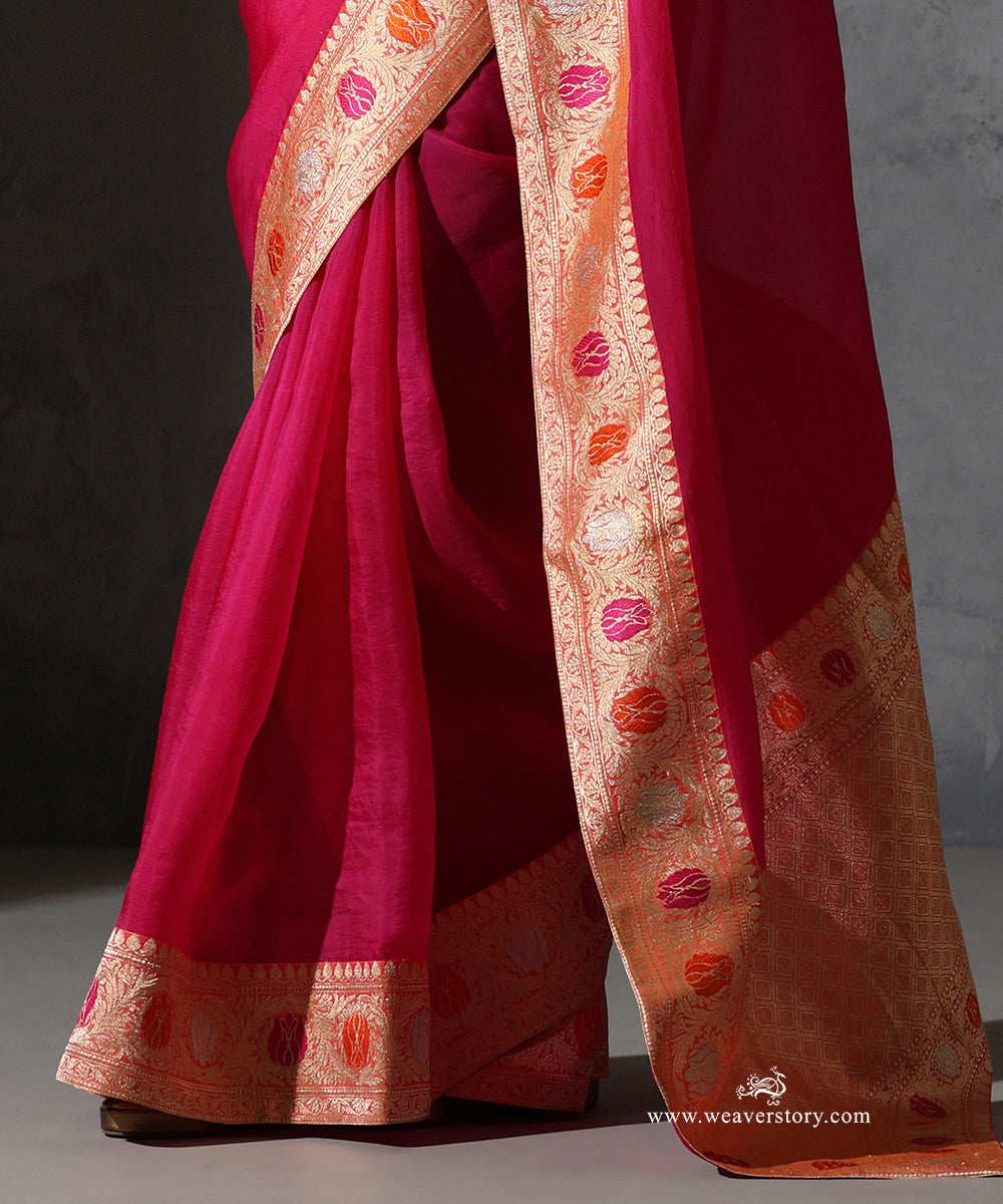 Close-up of Tilottama magenta pure silk organza saree with vintage Banarasi zari border and pink and orange meenakari motifs.