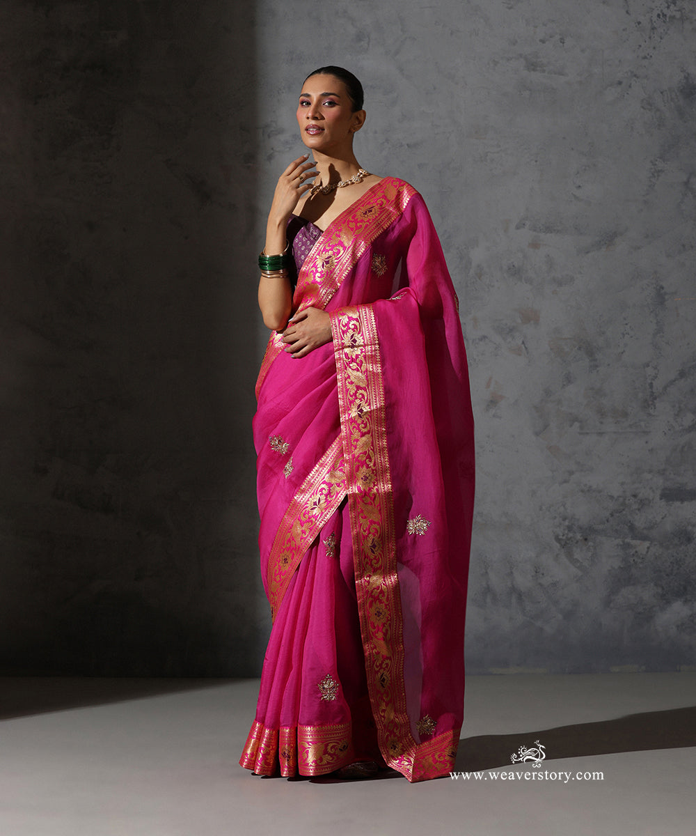 Full-length view of Madhulika hot pink pure silk organza saree with hand-embroidered bootis and ornate gold Banarasi border.