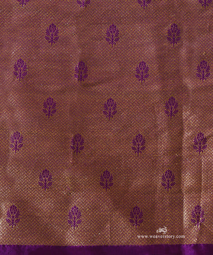 Close-up of brocade blouse fabric paired with Vaijayanti purple organza saree, showing fine zari weave and floral motifs.