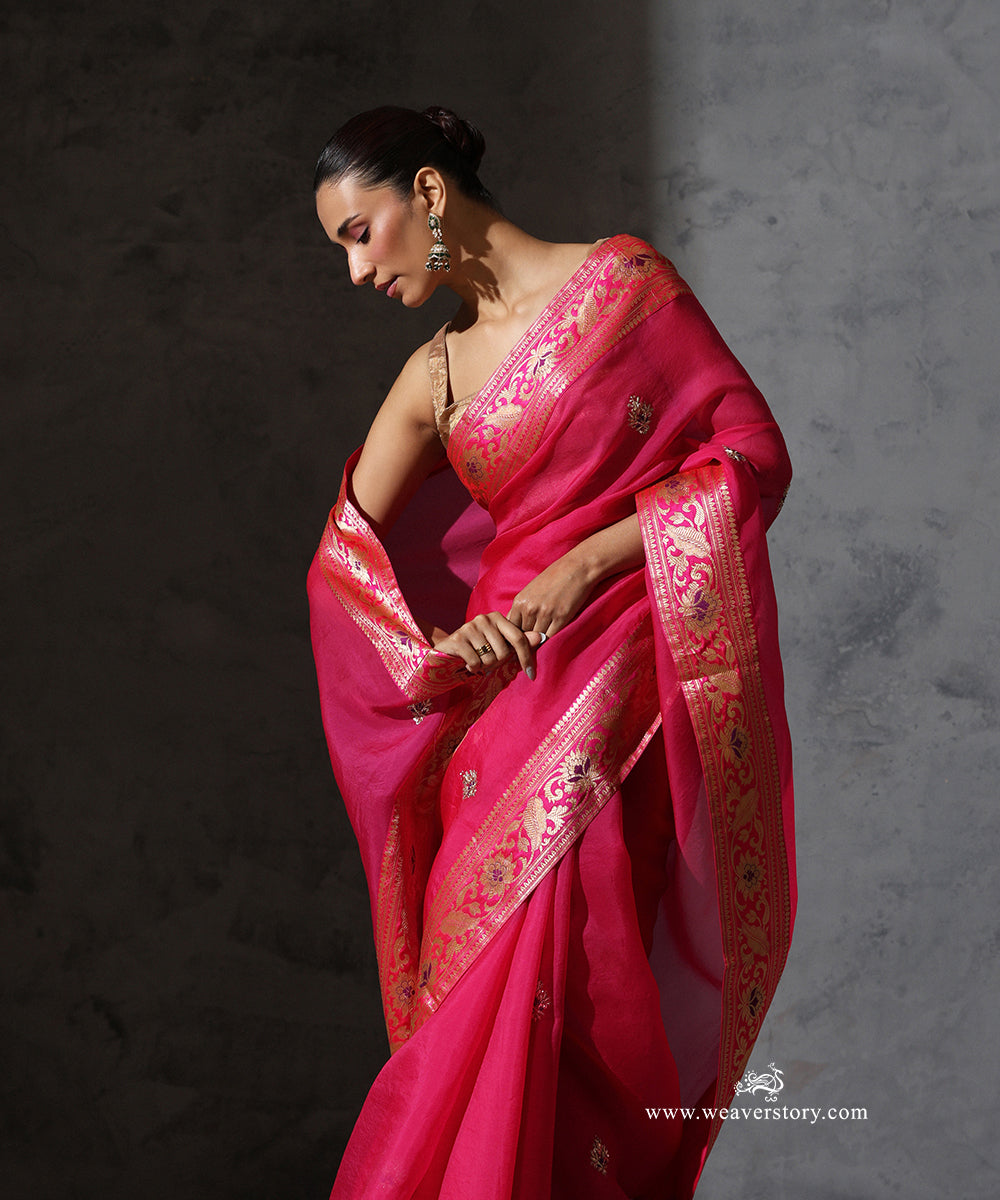 Vasundhara hot pink pure silk organza saree with hand-embroidered zardozi bootis and vintage Banarasi meenakari border.