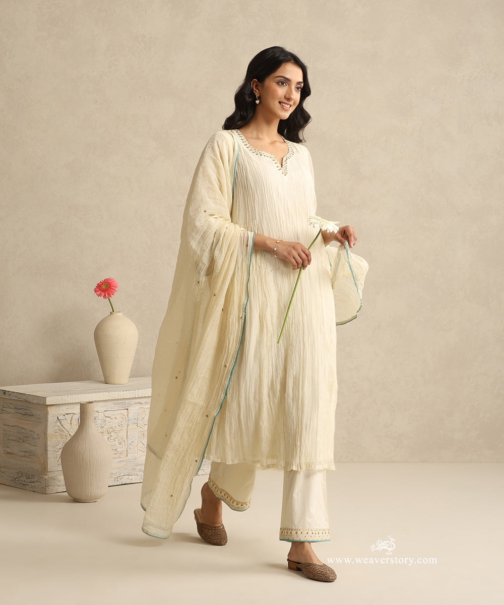 Ivory_Handloom_Mul_Chanderi_Suit_Set_With_Hand_Embroidery_And_Blue_Piping_WeaverStory_01