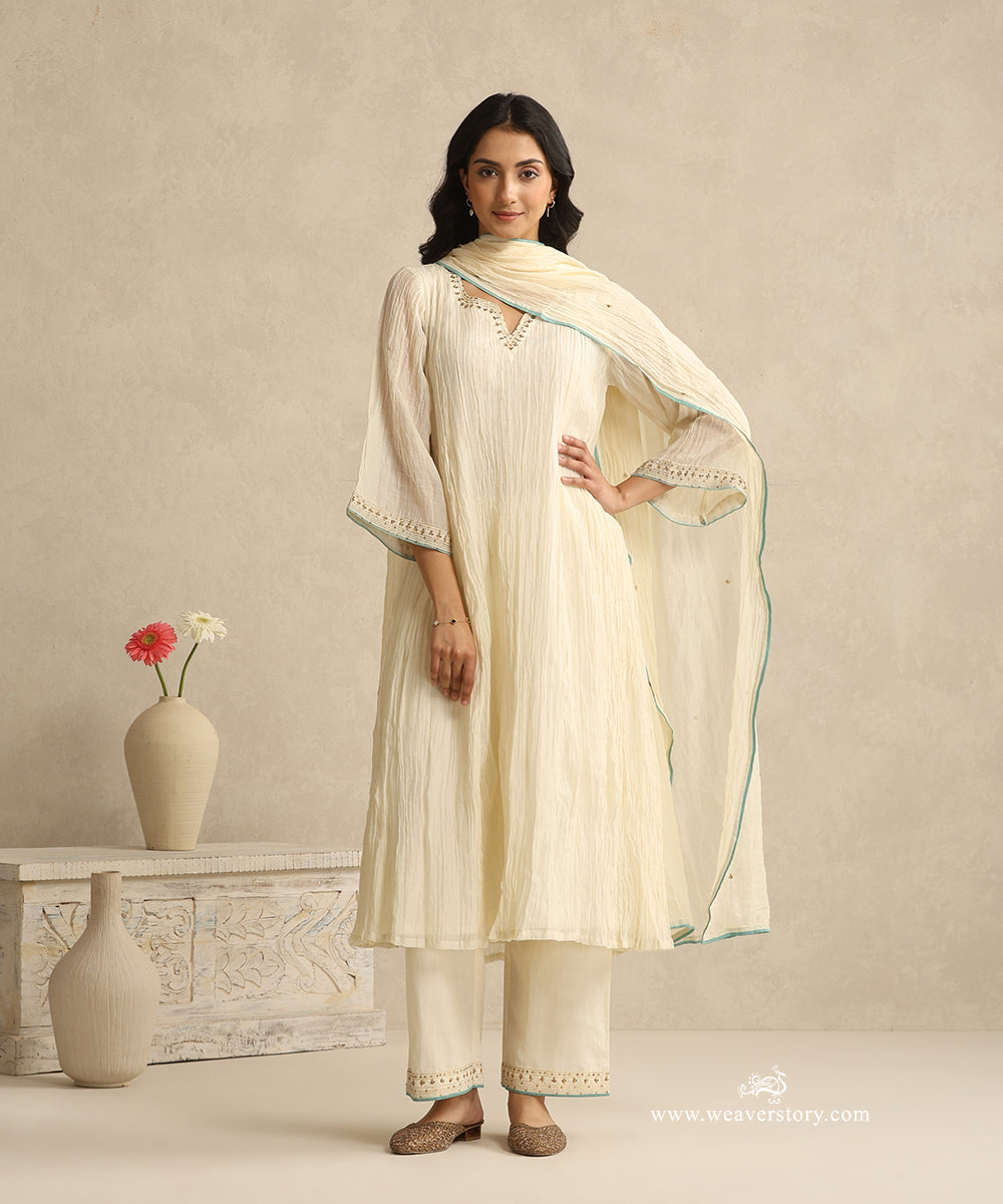 Ivory_Handloom_Mul_Chanderi_Suit_Set_With_Hand_Embroidery_And_Blue_Piping_WeaverStory_02