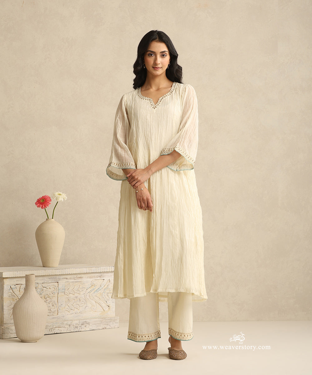 Ivory_Handloom_Mul_Chanderi_Suit_Set_With_Hand_Embroidery_And_Blue_Piping_WeaverStory_03