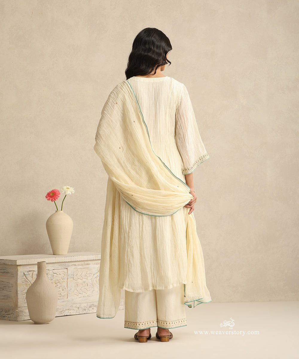 Ivory_Handloom_Mul_Chanderi_Suit_Set_With_Hand_Embroidery_And_Blue_Piping_WeaverStory_04