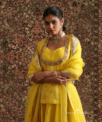 Yellow hand-embroidered organza top with Chanderi silk blouse and Lampi gota dupatta border