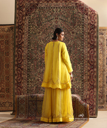 Back View of Yellow Pure Silk Organza Lehenga Set Showing Hand Embroidered Borders and Gota Lace Panel Detailing