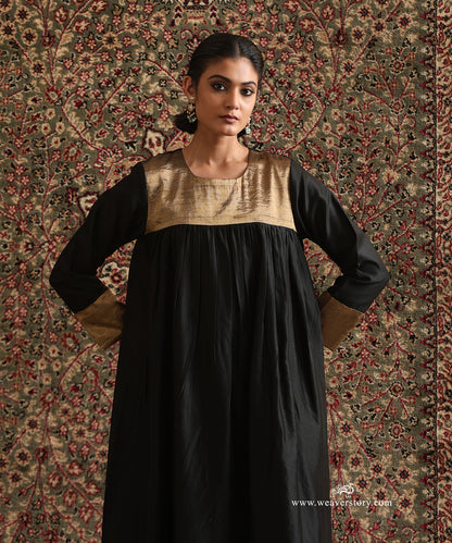 Close-up of Black Pure Chanderi Silk High-Low Anti-Fit Kurta featuring a gold tissue yoke and coordinating tissue cuffs