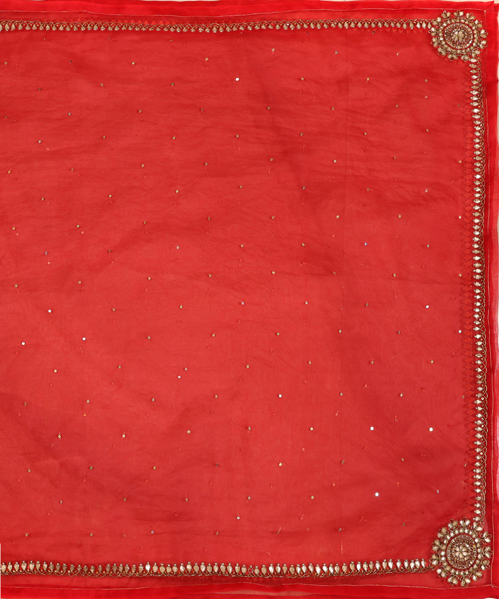 Full view of red silk organza dupatta featuring all-over sequins, a metallic gota patti border and statement zardozi motifs at the corners.