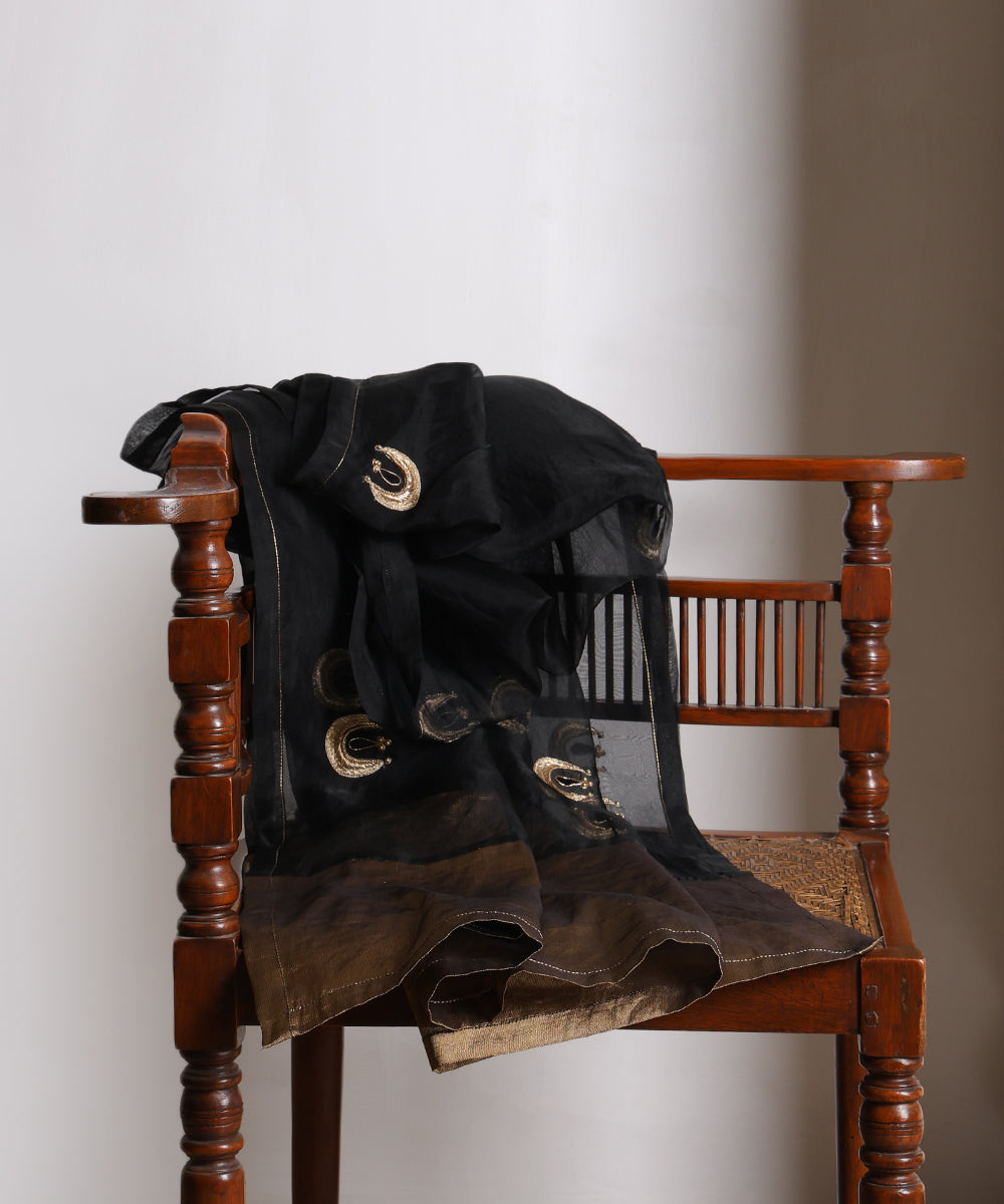 Full view of black silk organza dupatta with hand-embroidered gold zardozi chand bootis and a broad Chanderi tissue palla.