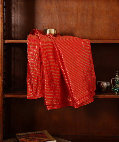 Red striped Tissue Chanderi dupatta with closely placed horizontal gold zari tagai