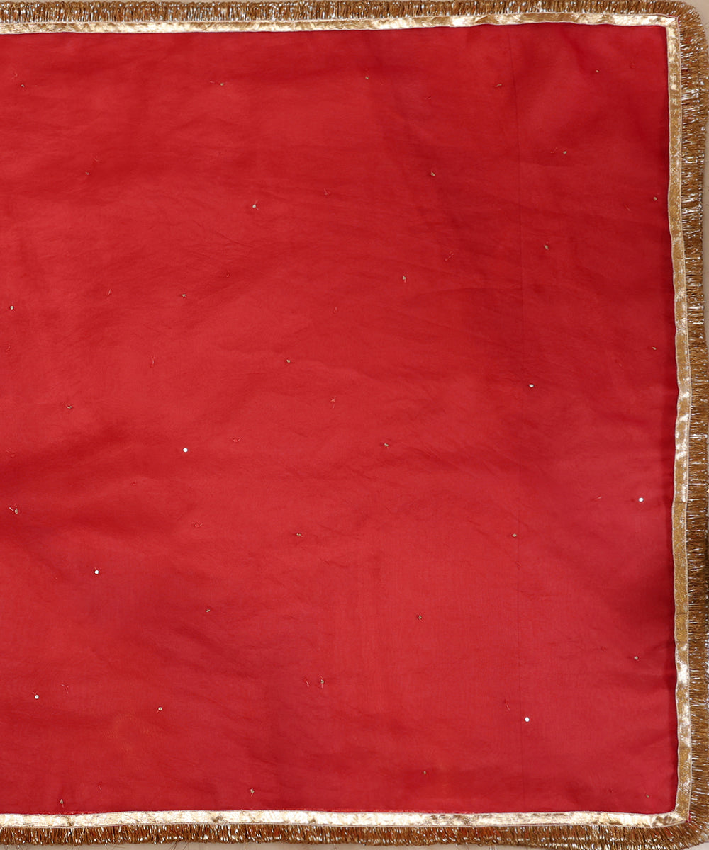 Full view of red silk organza dupatta featuring evenly scattered sequins and a handcrafted gota lampi border with kiran edging.