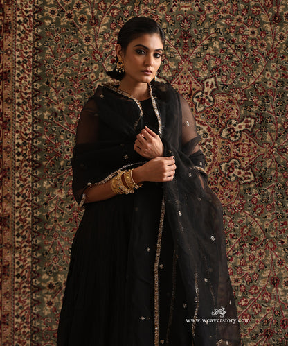 Black pure Chanderi silk wrinkled Anarkali styled with a pure silk organza dupatta featuring hand embroidered floral motifs and a handcrafted kiran border