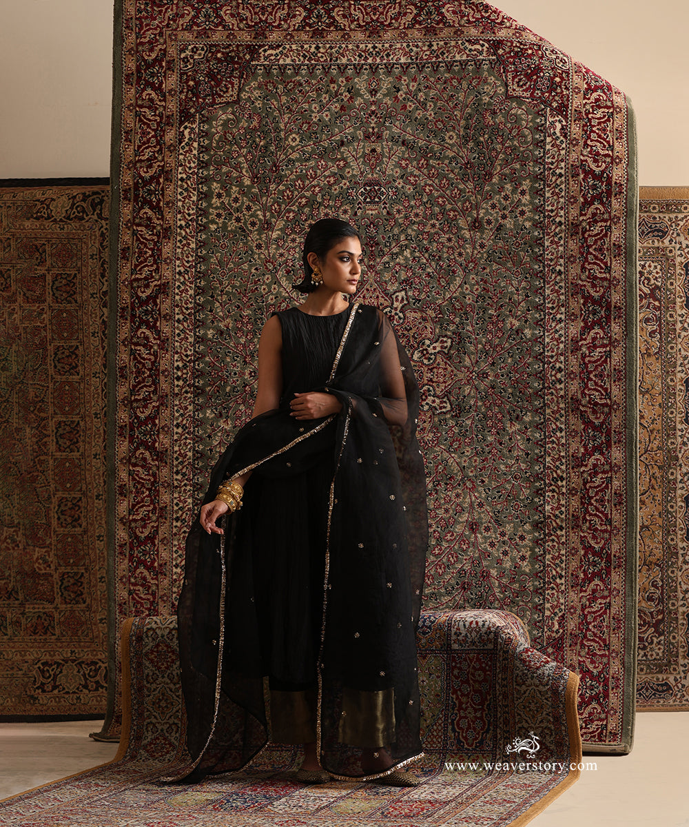 Black pure Chanderi silk wrinkled Anarkali styled with a pure silk organza dupatta featuring hand embroidered floral motifs and a handcrafted kiran border