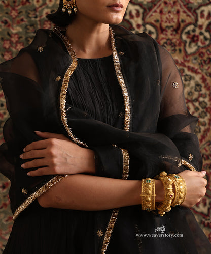 Close-up of black pure silk organza dupatta with hand embroidered floral motifs and handcrafted kiran border paired with a pure Chanderi silk wrinkled Anarkali