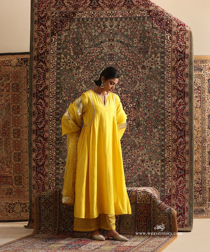 Yellow pure Chanderi silk kurta with hand embroidered neckline and curved panel detailing